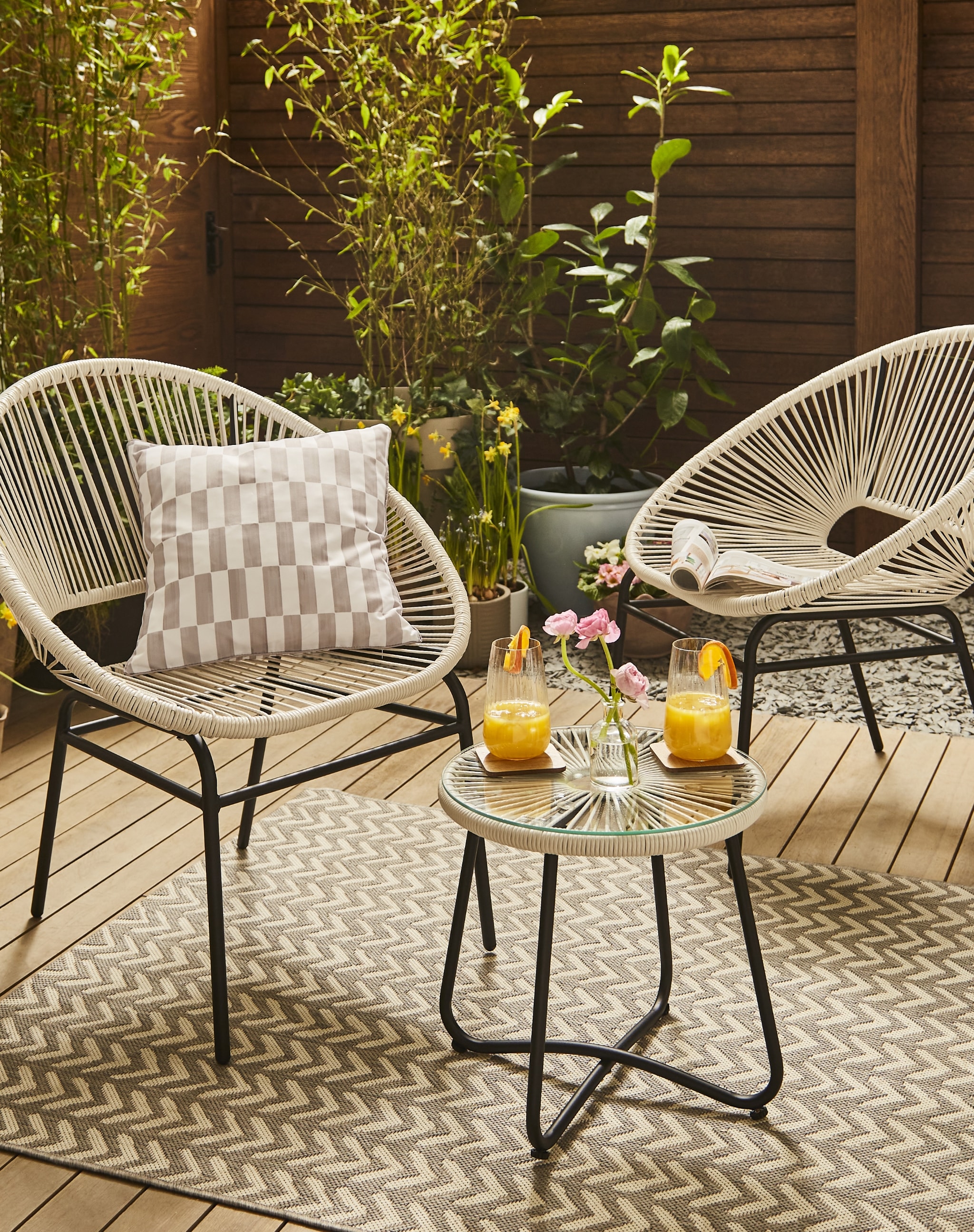 Garden decor with woven bucket chairs